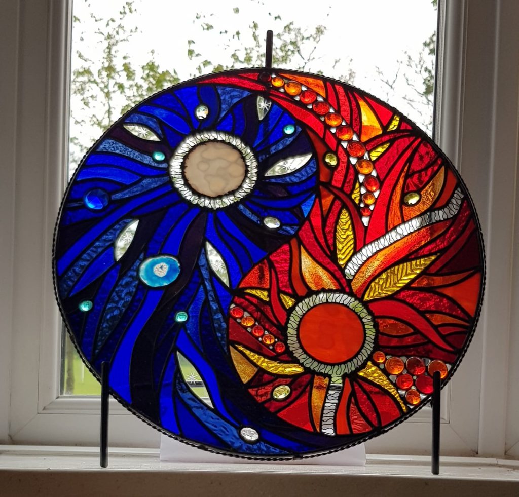 Commission stained glass circular blue orange
