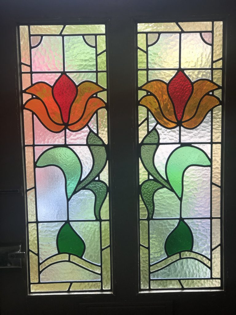 Commission stained glass door panels large tulip orange red