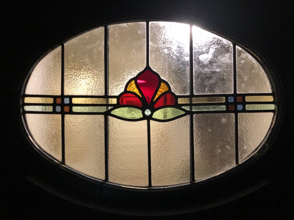 Commission stained glass oval window red flower amber