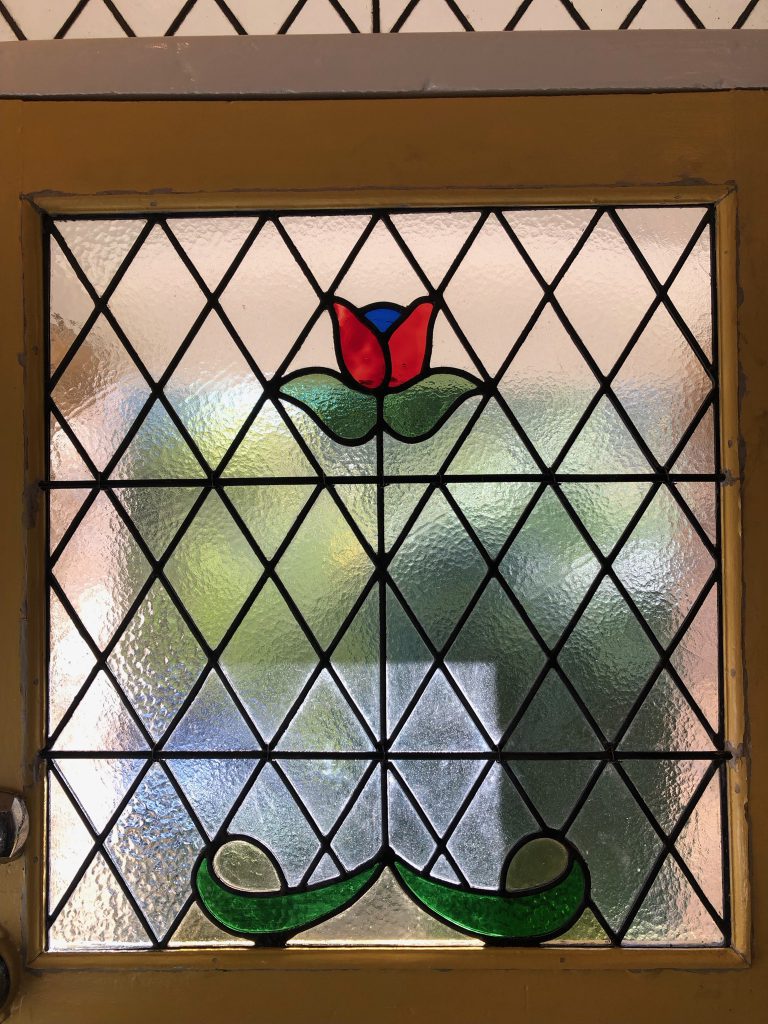 Commission stained glass window diamond red tulip repair