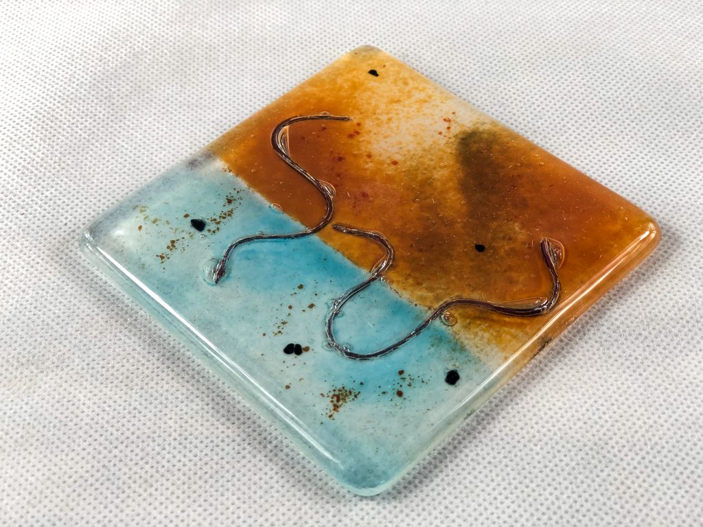 Fused glass tile snake orange blue