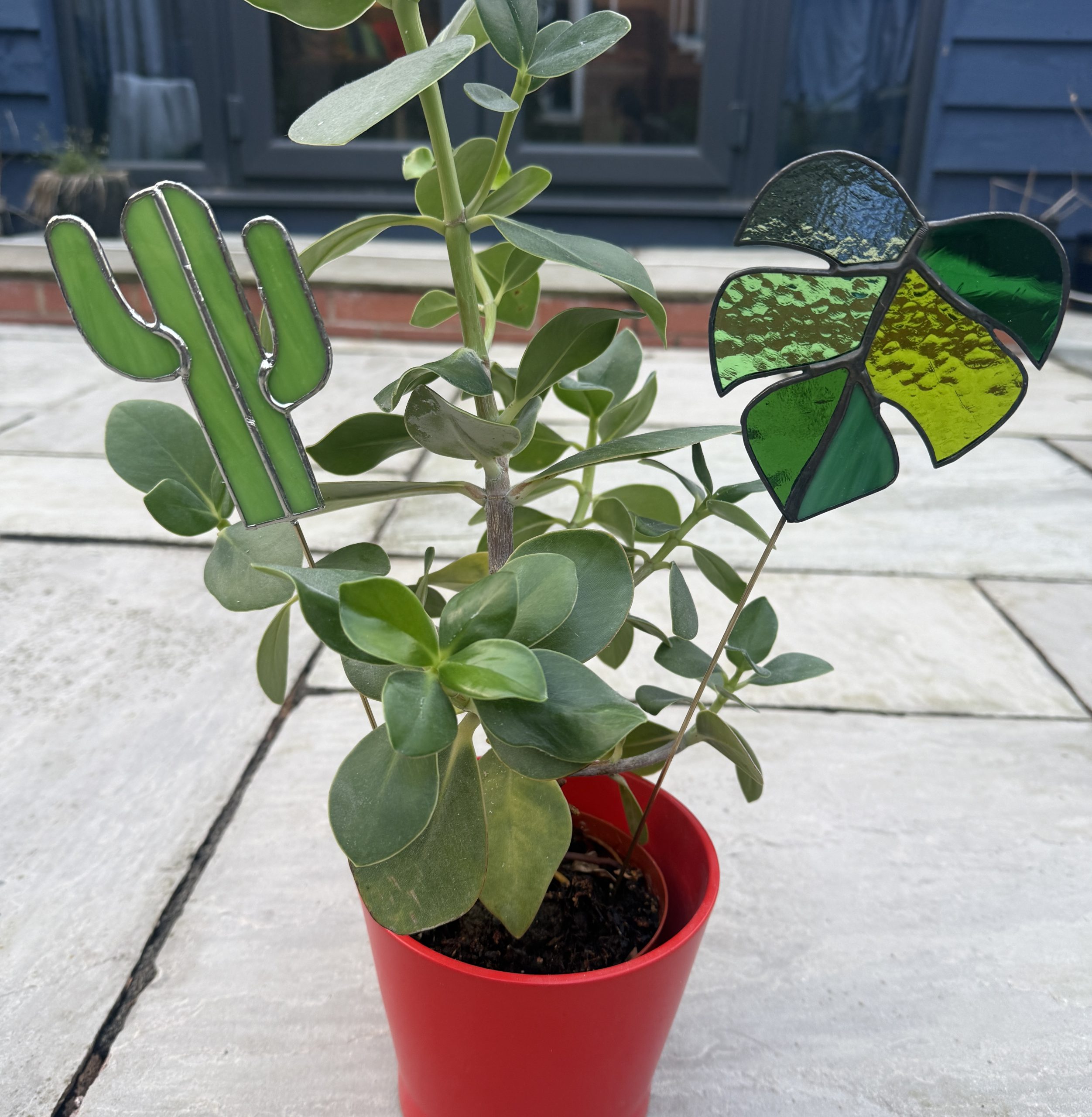Stained glass cactus and monstera plant stakes