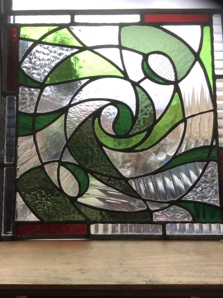 Stained glass abstract green wave celtic