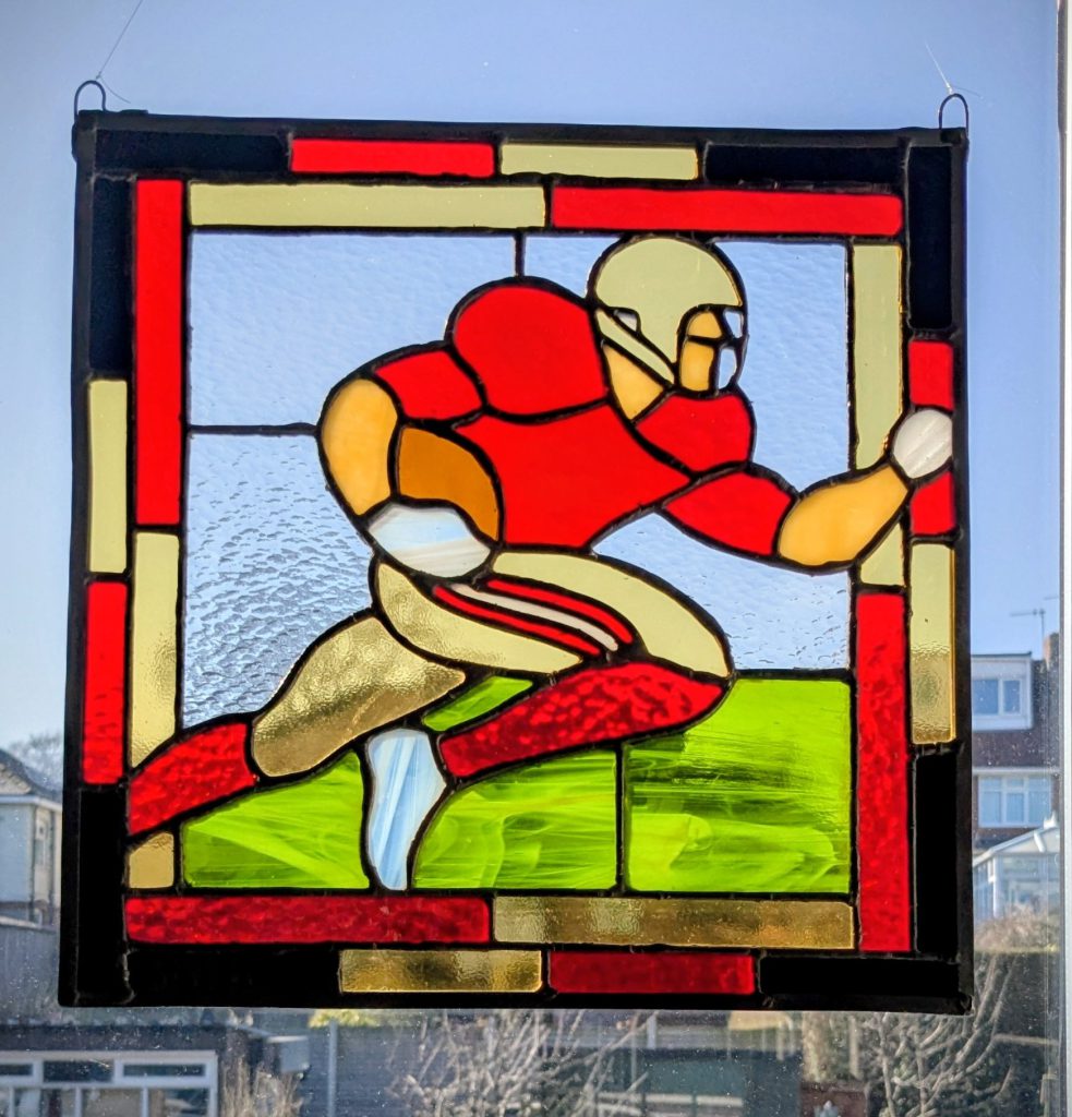 Stained glass american football player panel