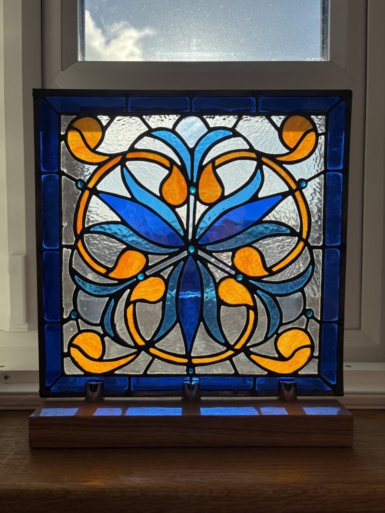 Stained glass art nouveau floral window installed