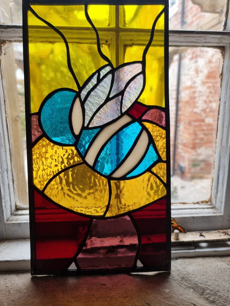 Stained glass bee panel blue gold