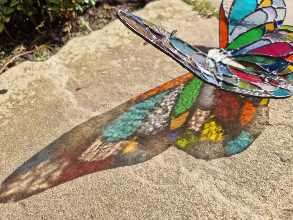 Stained glass butterfly rainbow light shadow