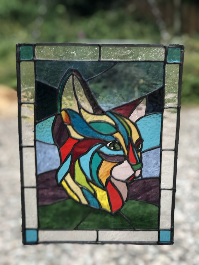 Stained glass cat portrait colourful