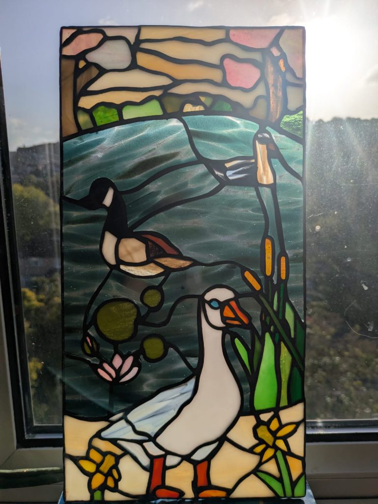 Stained glass ducks pond daffodils panel