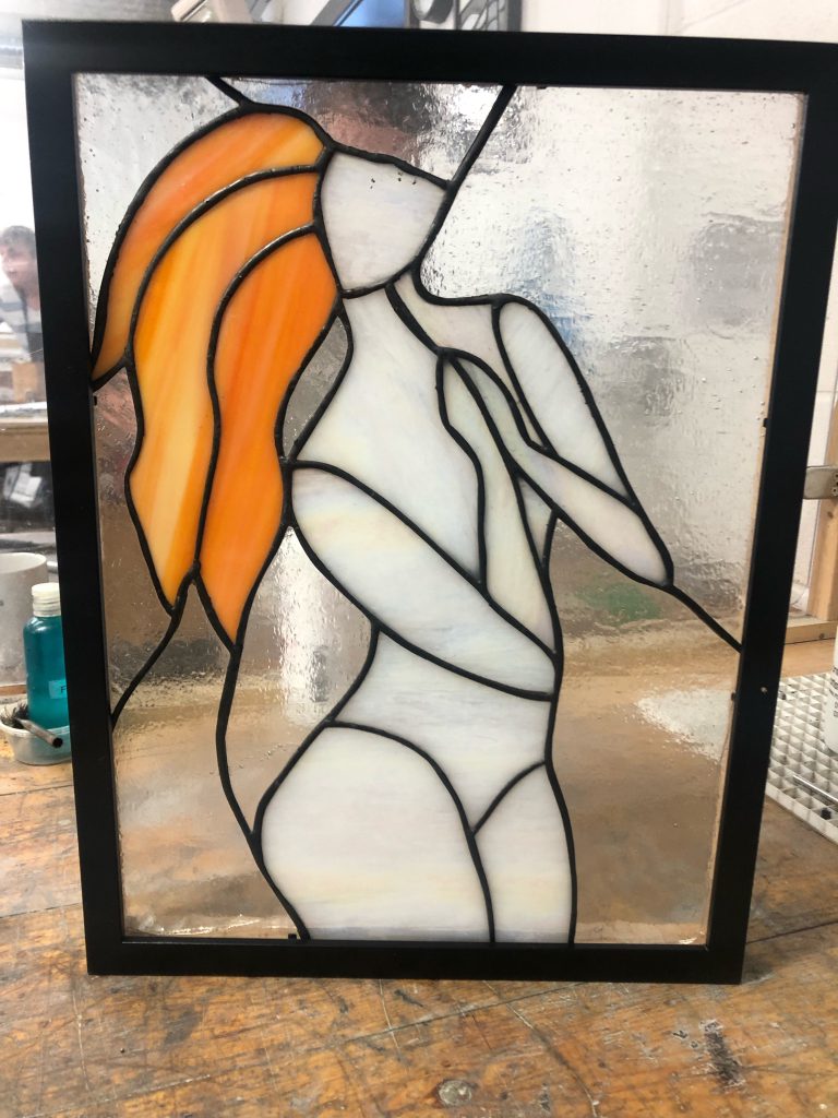 Stained glass female figure red hair