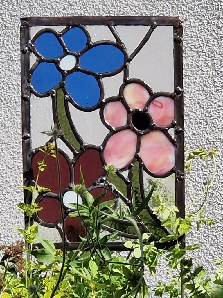 Stained glass flowers pink blue wall panel
