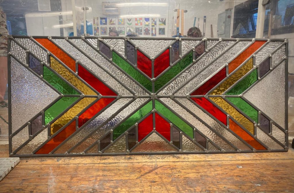 Stained glass geometric chevron star panel