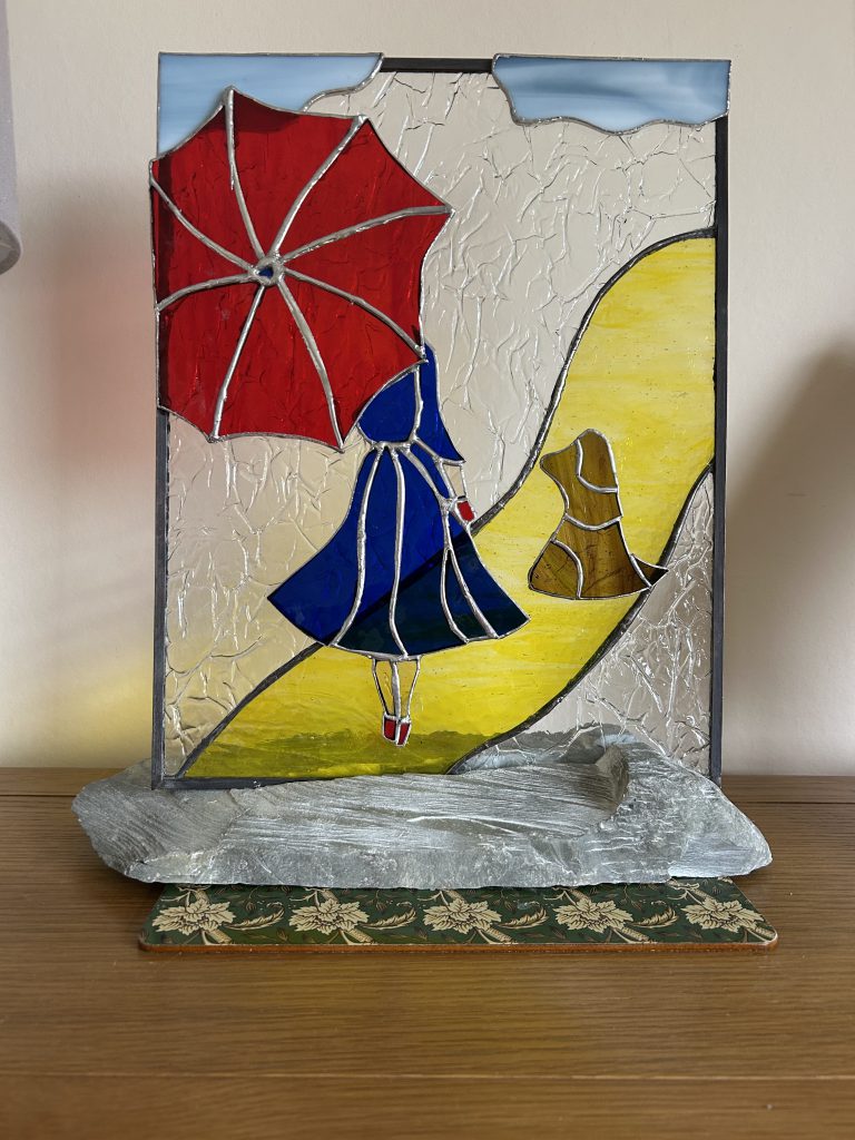 Stained glass lady red umbrella dog