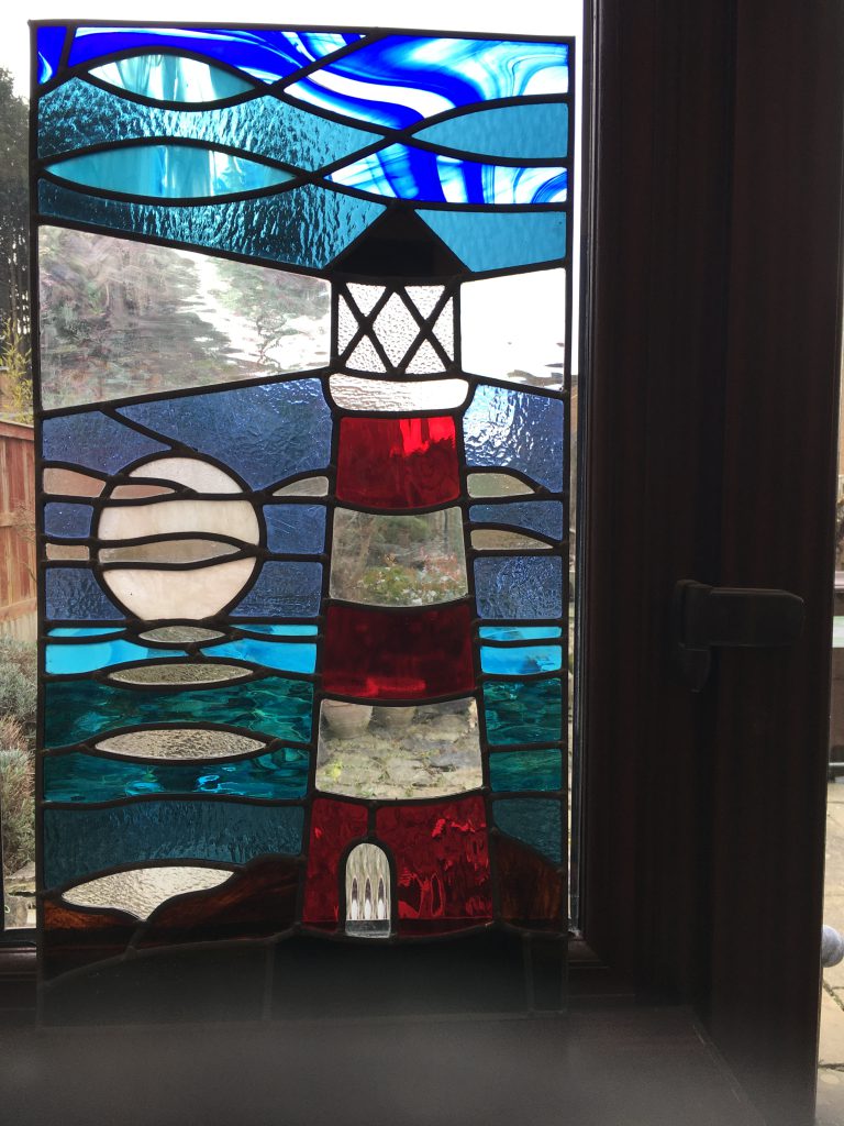 Stained glass lighthouse panel horizontal installed