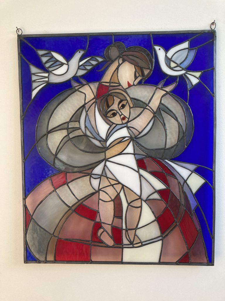 Stained glass mother child doves panel