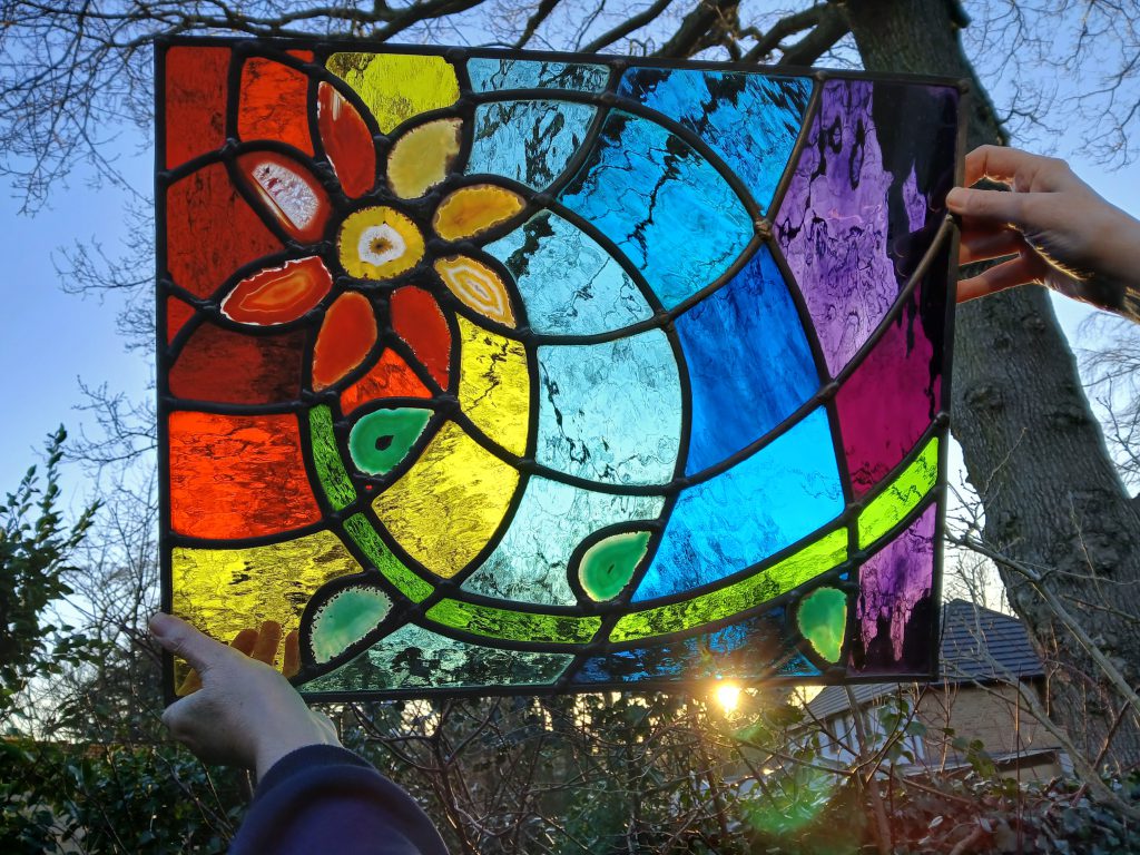 Stained glass rainbow swirl daisy panel