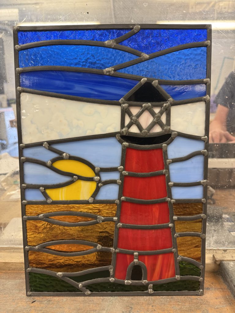 Stained glass red lighthouse coastal panel