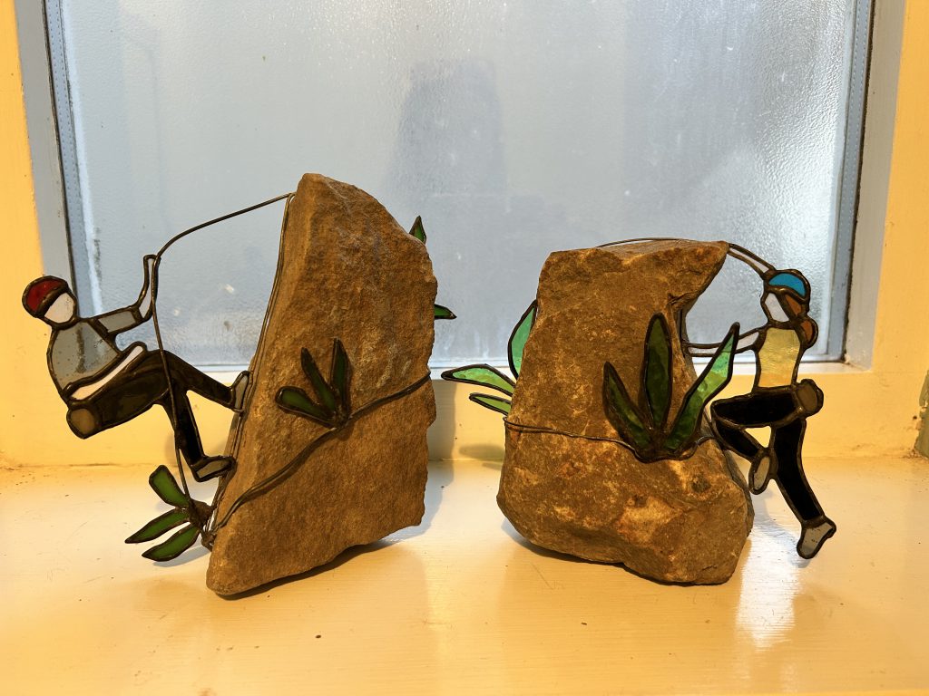 Stained glass rock climbers sculpture