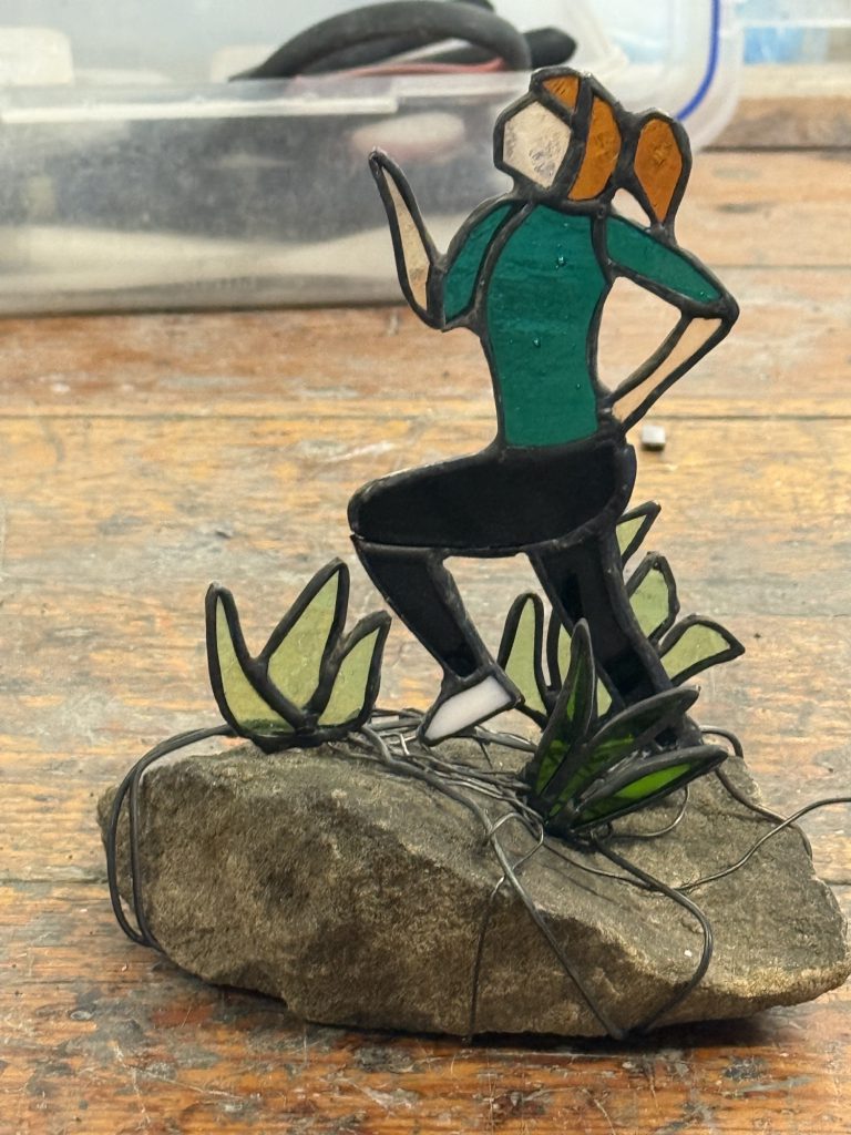 Stained glass running woman sculpture stone base