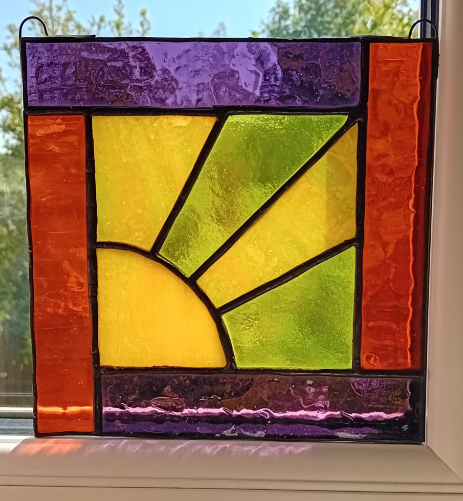 Stained glass sunrise panel orange purple