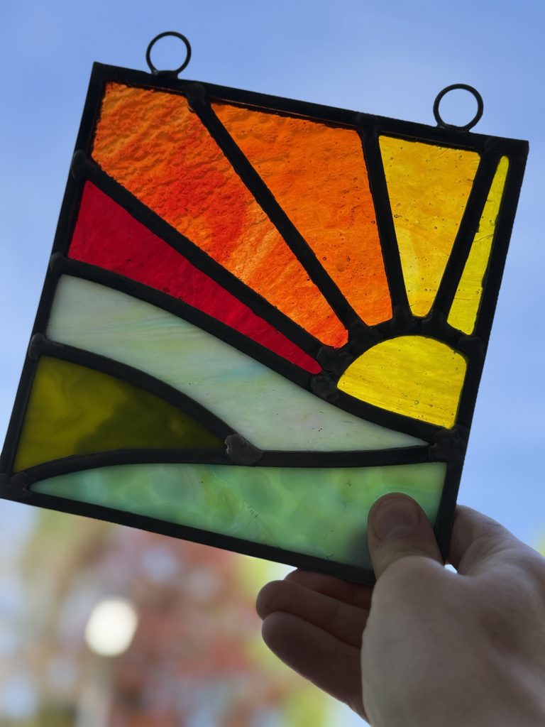 Stained glass sunrise rays suncatcher