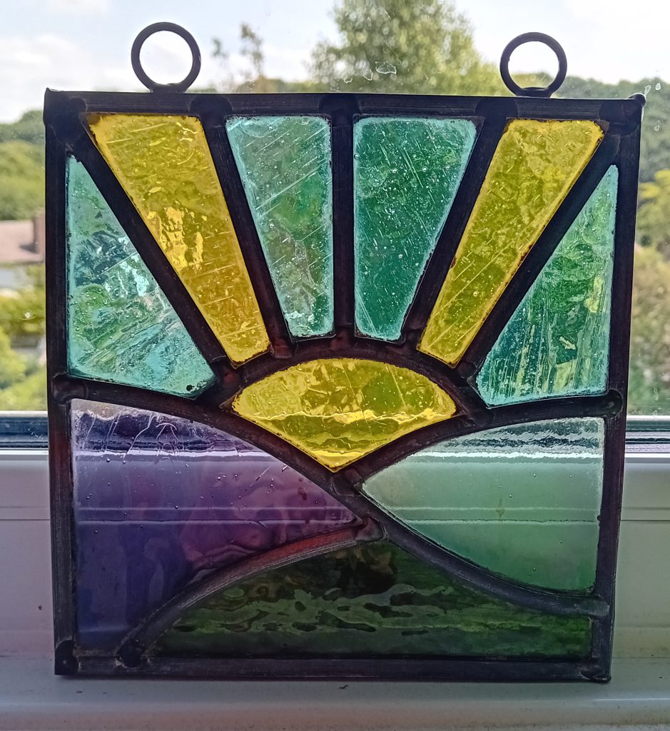 Stained glass sunrise suncatcher yellow teal