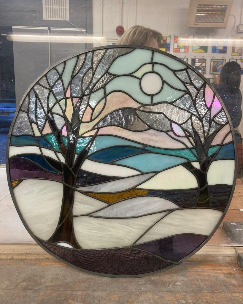 Stained glass winter trees circular panel