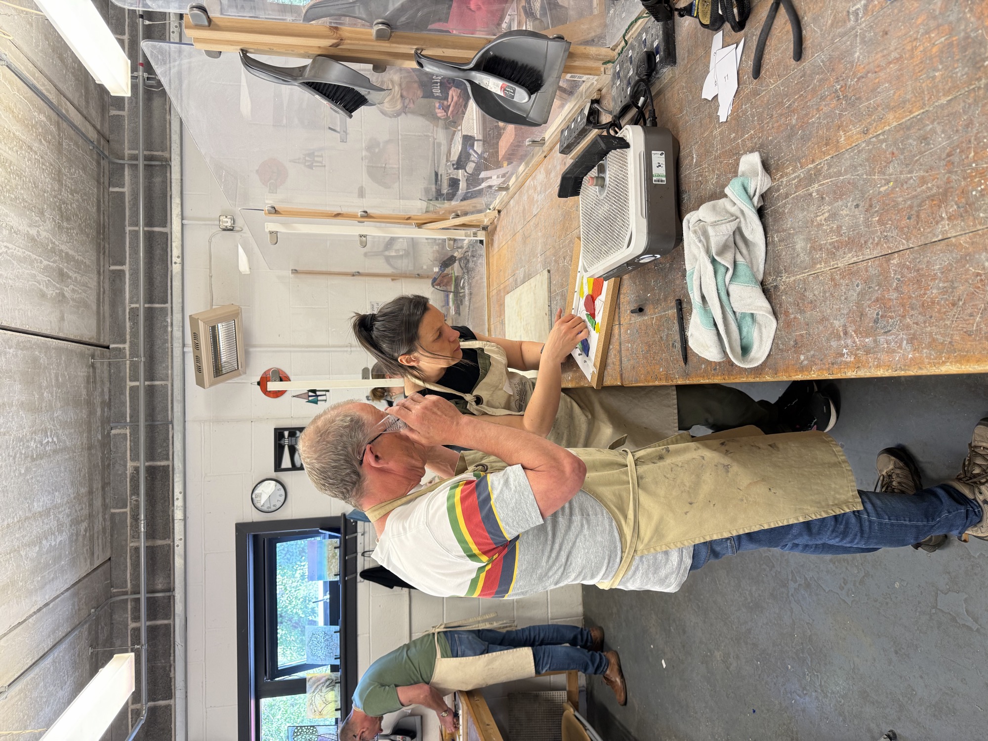 Students working in a stained glass class