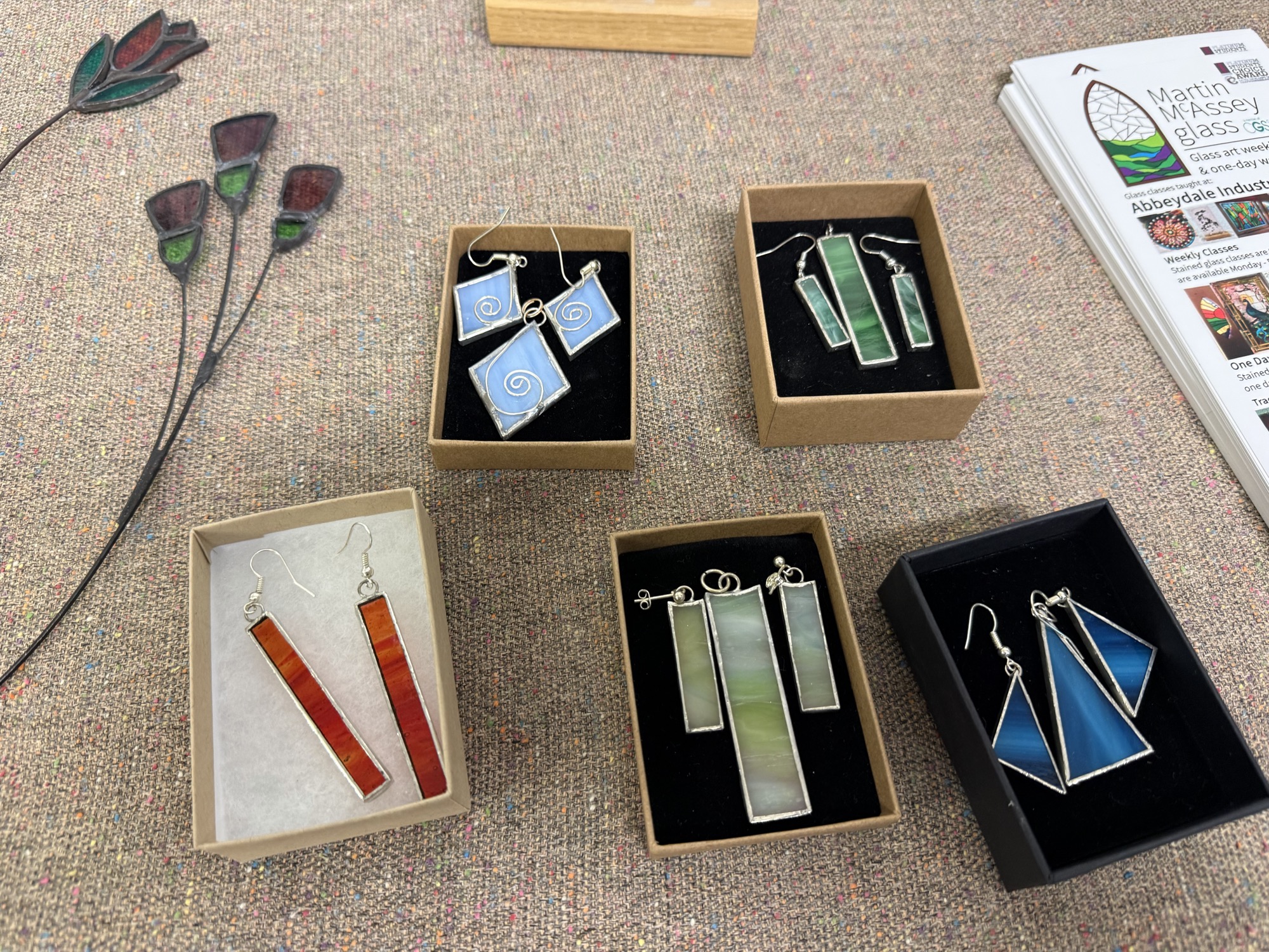 Stained glass workshop, cutting glass with tools