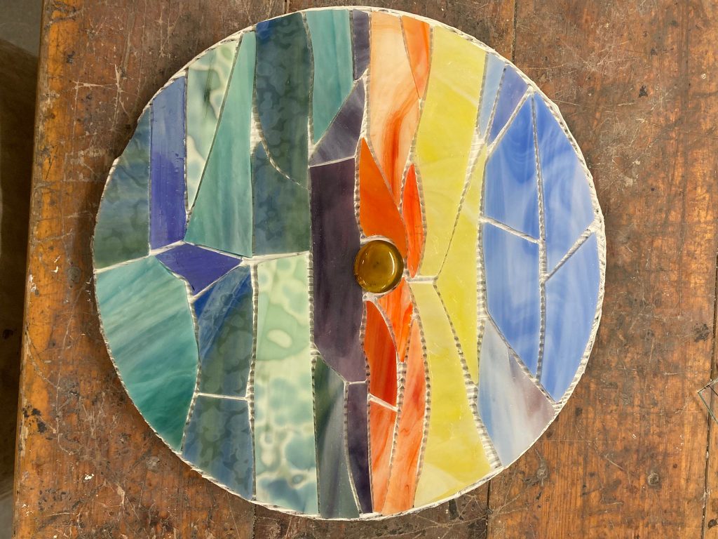 Student mosaic circular colourful stripes