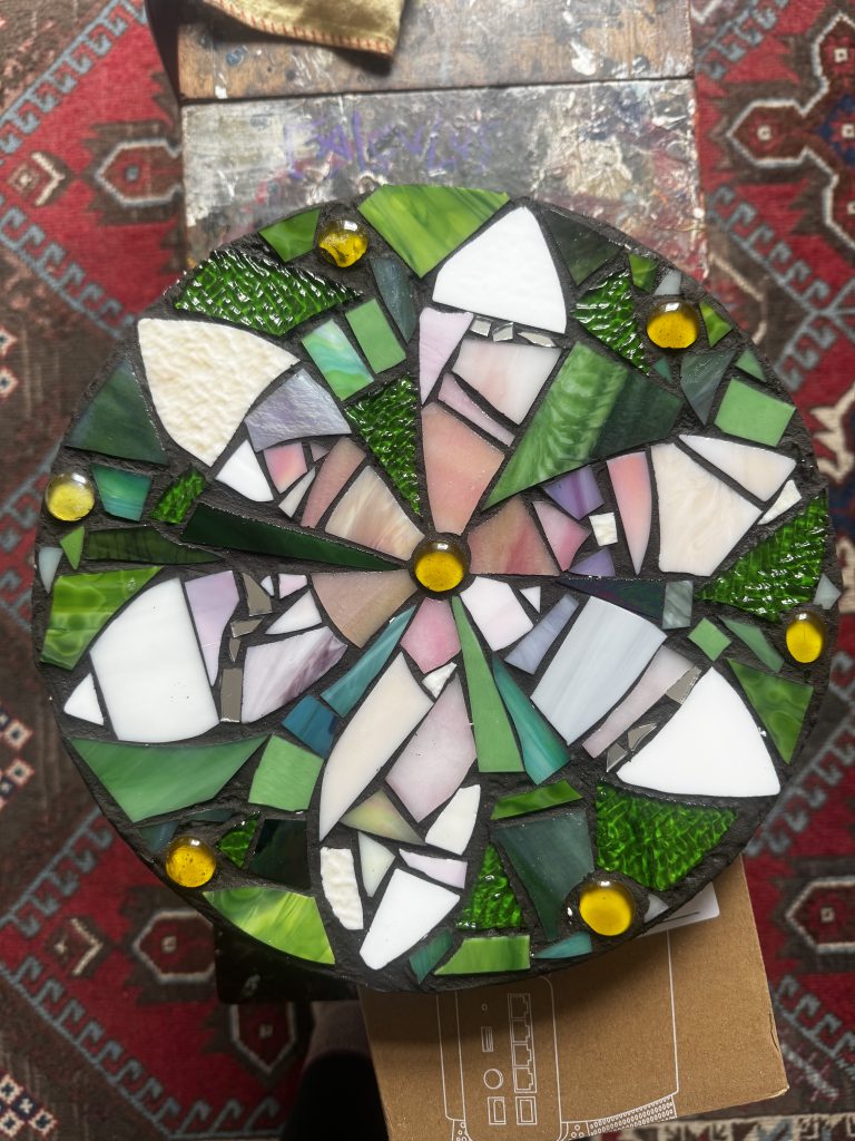 Student mosaic circular flowers green white