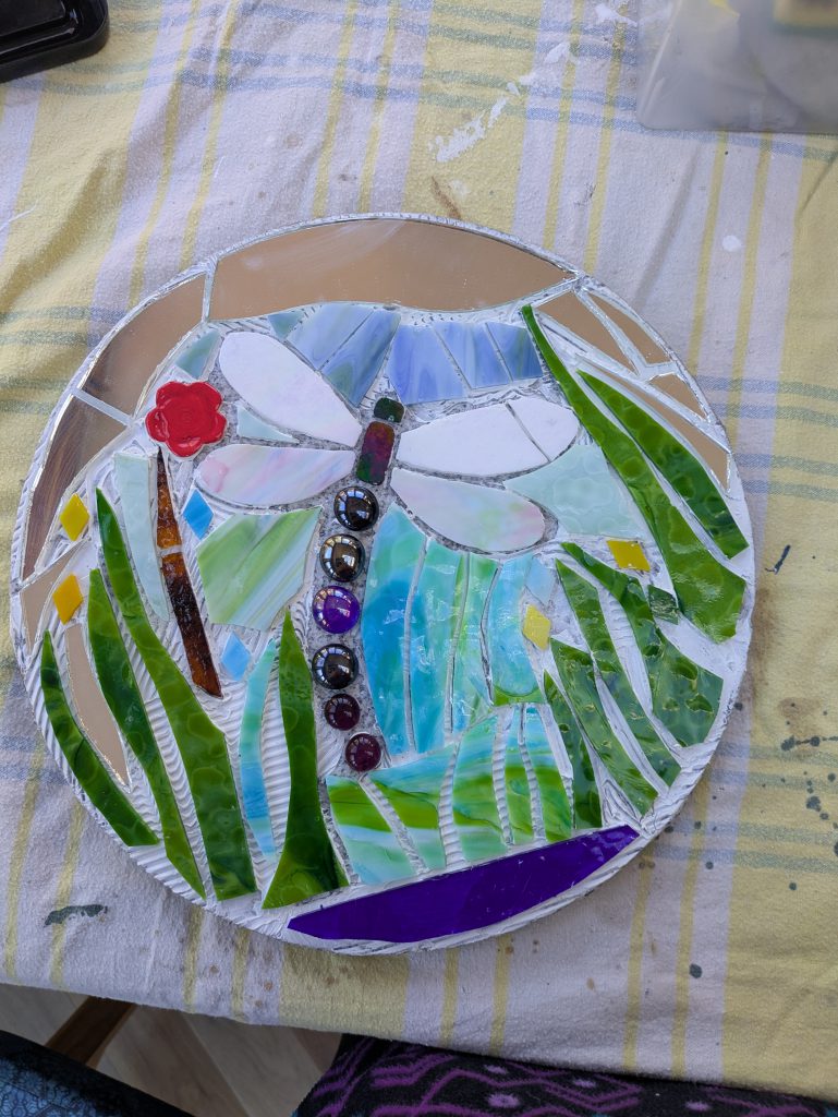 Student mosaic stepping stone dragonfly pond