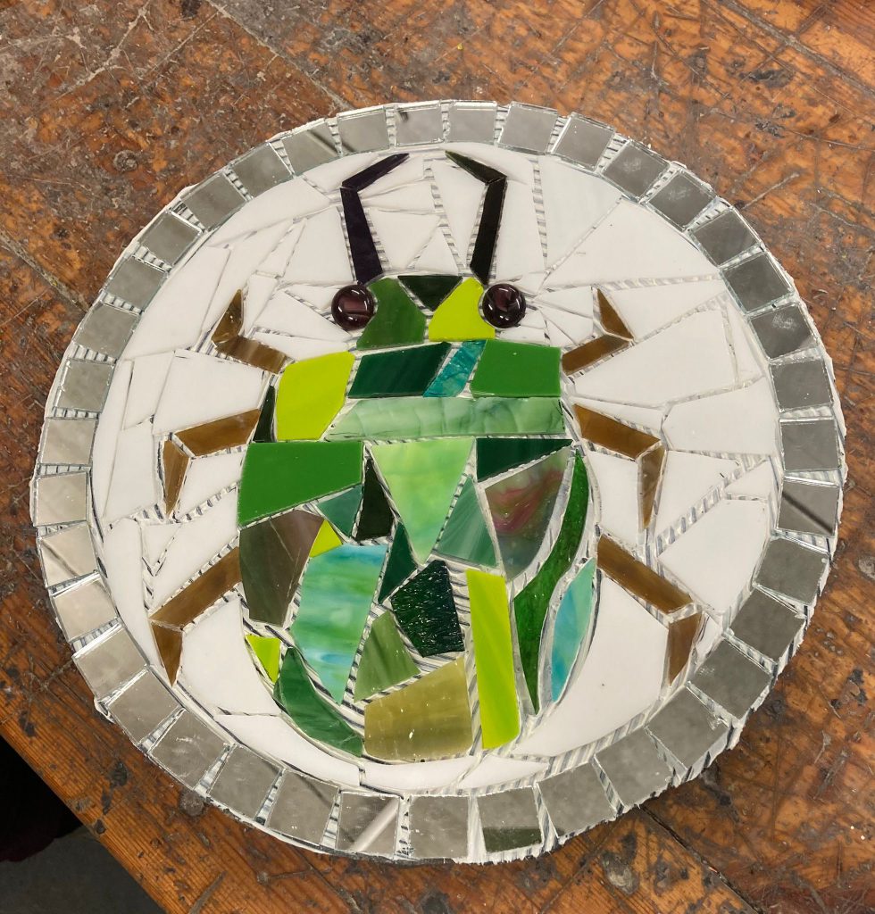 Student mosaic stepping stone scarab beetle green