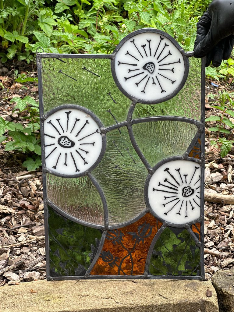 Student painted glass dandelion allium green panel