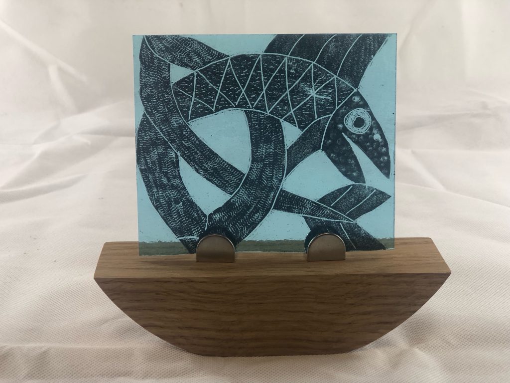 Student painted glass koi fish teal