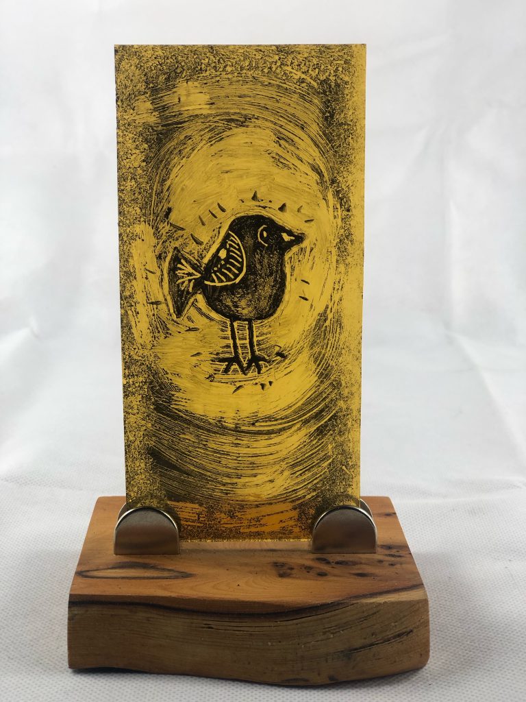 Student painted glass robin golden yellow tall