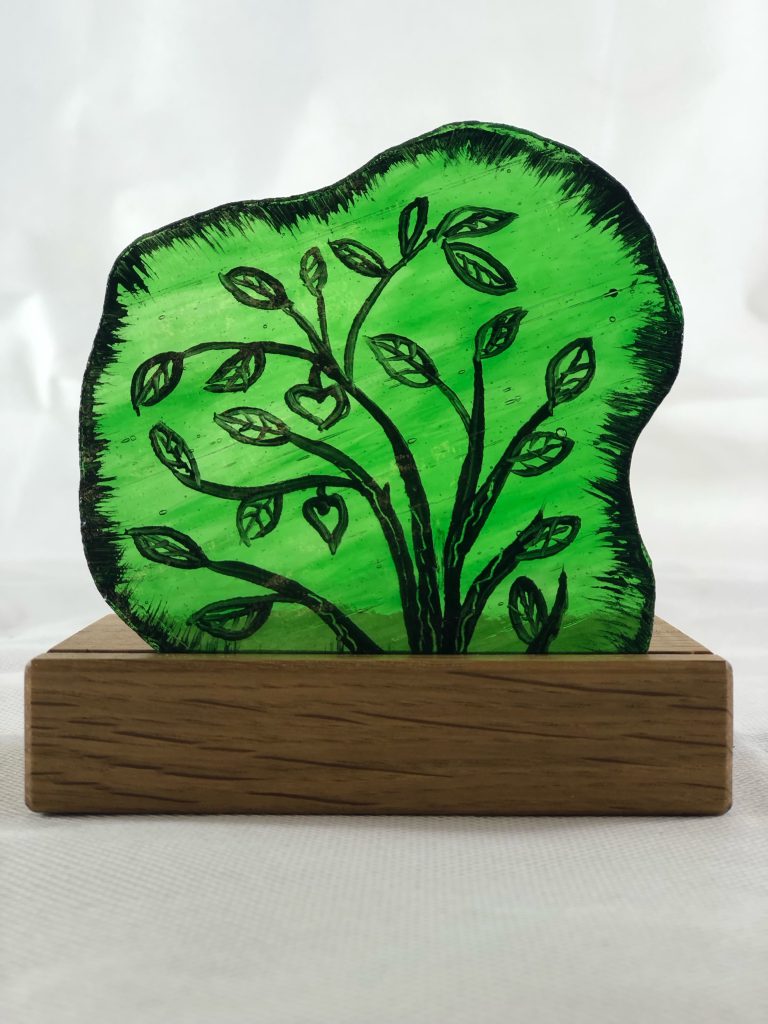 Student painted glass tree of life green shaped
