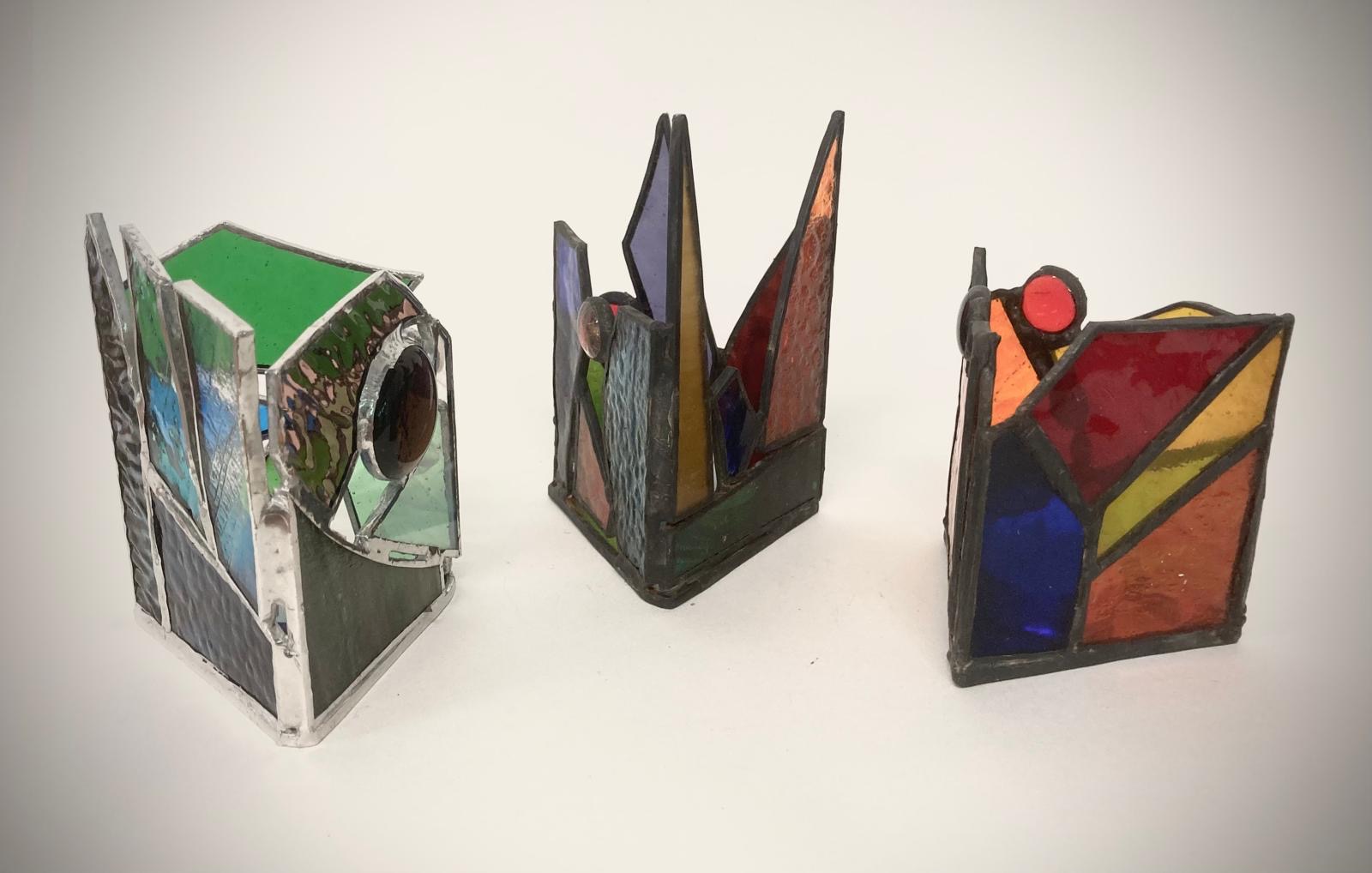 Three stained glass candle holders