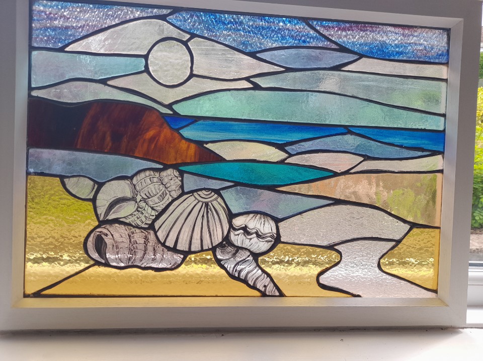 Student stained glass coastal beach shells moon framed