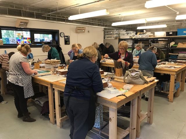 Students working in the stained glass studio