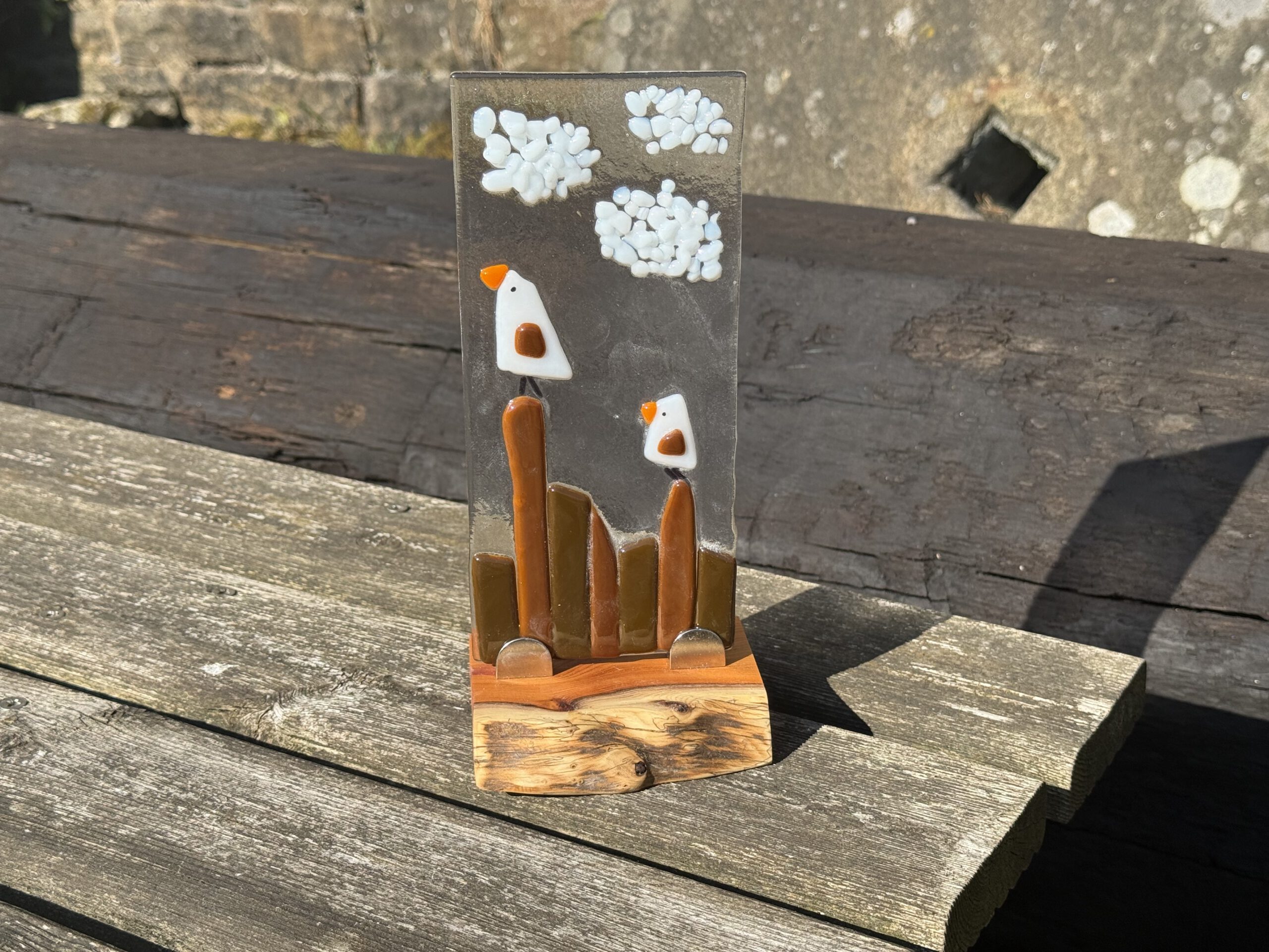 Fused glass panel — seagulls perched on wooden posts with clouds