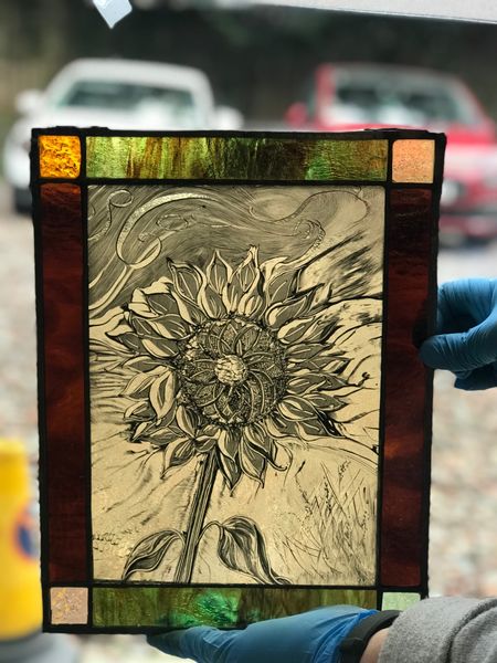 Student painted glass sunflower panel