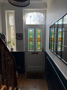 Student stained glass - leaded door panel hallway view