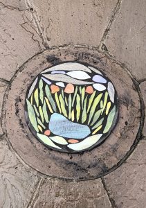 Student mosaic stepping stone with pond inset design